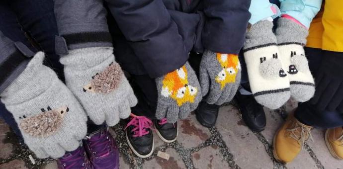 3 children wear the mittens